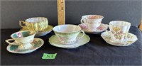 5 tea cups and saucers