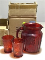 NIB red glass pitcher and cups.