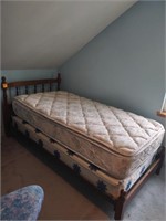 Standard twin bed mattress with frame and