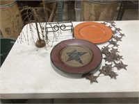 Decorative plates, strand of stars, a wire a tree