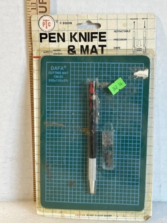 Vintage pen, knife, and mat
