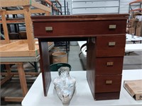 Sewing machine cabinet & Mary concrete statue.