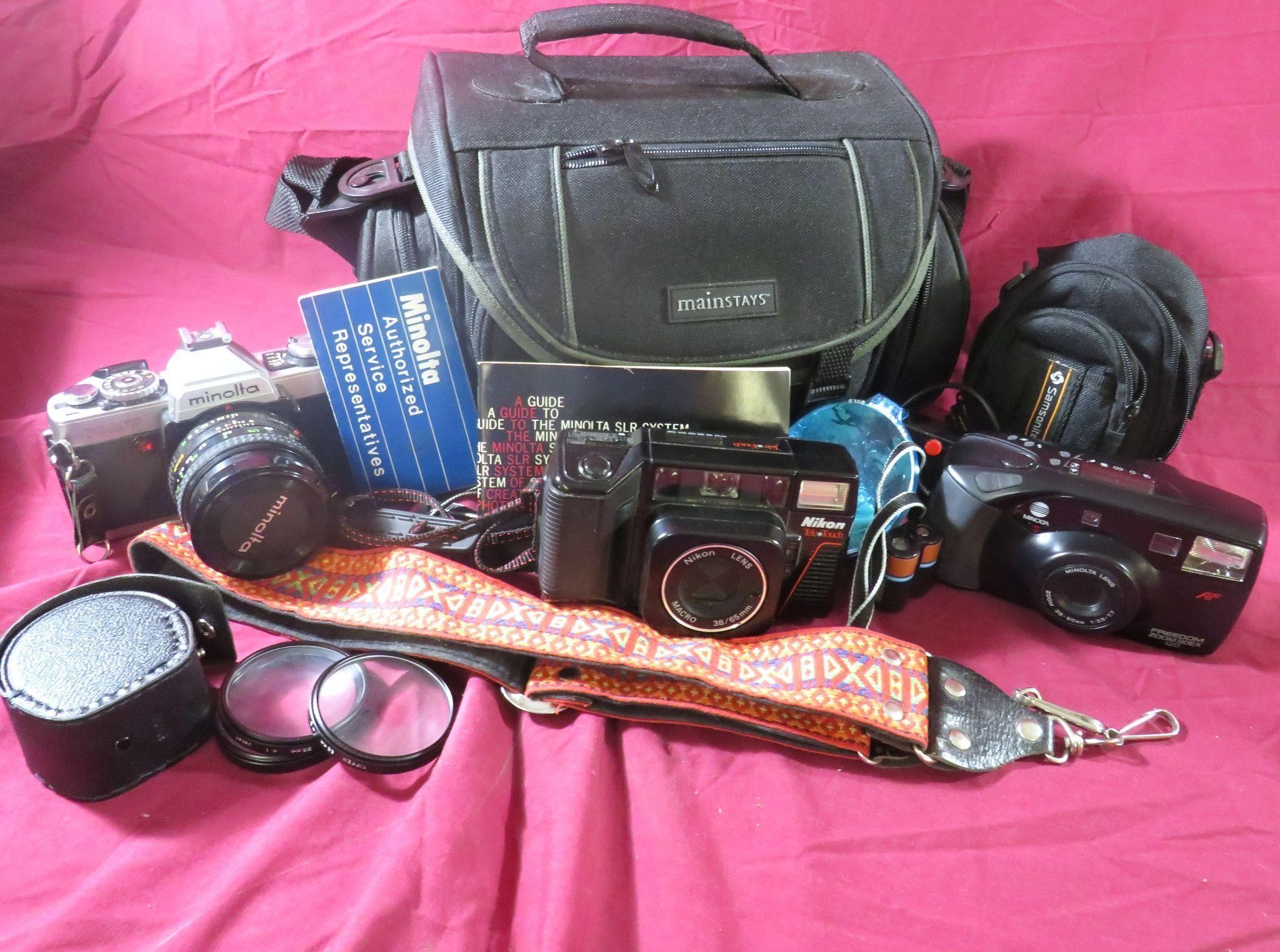 NIKON CAMERA WITH 2 MINOLTA CAMERAS AND MORE