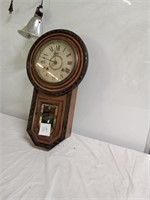 Wall clock with pendulum.