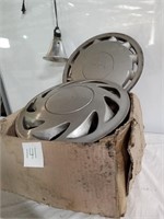 Box of miscellaneous hub caps