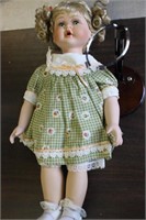 Porcelain Baby Doll w/stand  Green dress