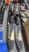 O’Brien waters skis and safely vest