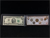 $2 Bill And Coins In Folder