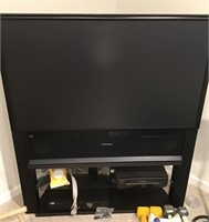 Magnavox 50" TV, stand, VCR, and DVD player