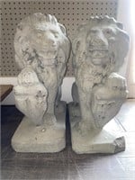 Pair of Concrete Lion Statues. Approx. 19” tall.