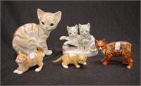 Five various cat figurines