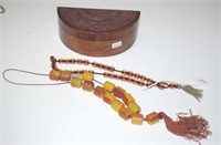 Oriental carved wood casket & amber necklaces