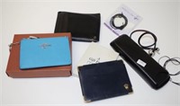 Group of various wallets and accessories