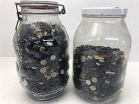 2 large glass jars with buttons as contents