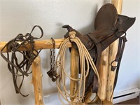 Antique saddle, hobbles and rein