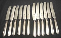Twelve matching silver plated handle knives