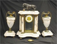 A French portico lion mounted clock garniture