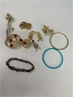 Bag of Bracelets and Brooches