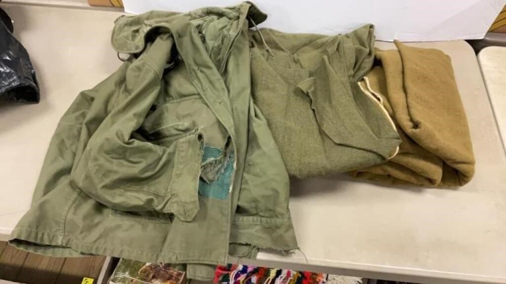 Army blankets, and rough looking large jacket