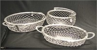 Three decorative metal baskets