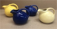 Four mini pitchers