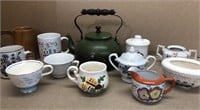 Green teapot w/mugs, tea cups & assorted creamers