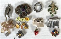 12 brooches and or pins