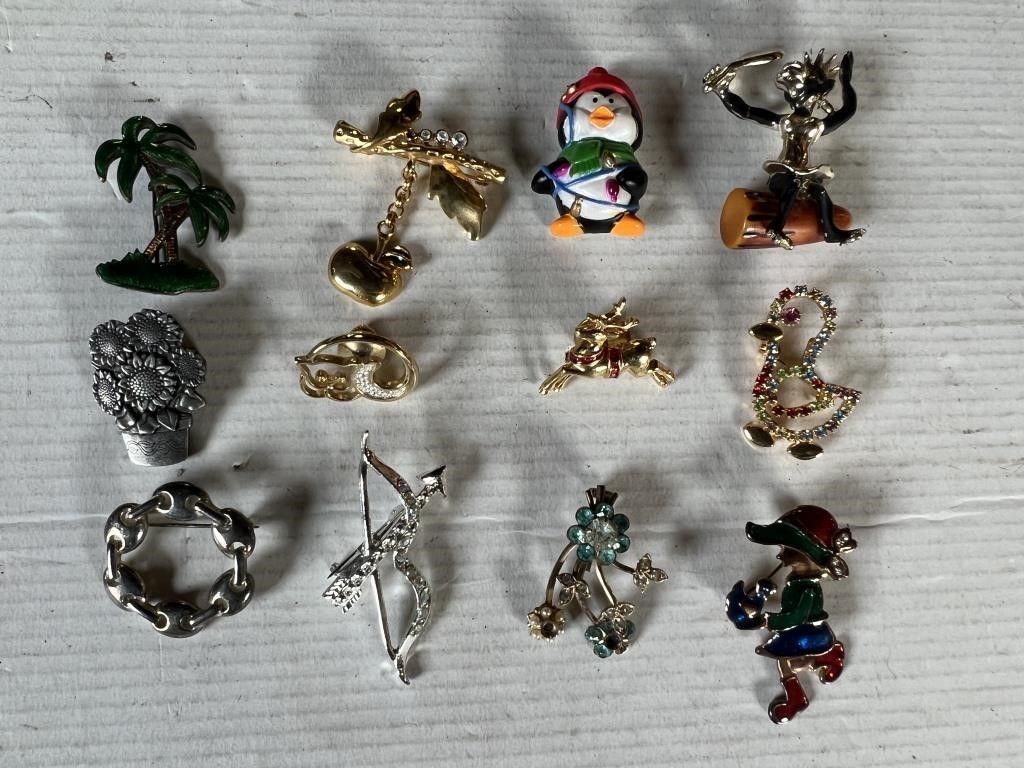 12 brooches and or pins