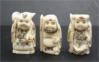 Three Japanese carved bone sage netsukes