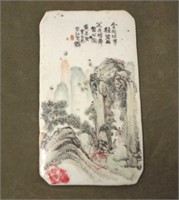 Antique Chinese tile with mountain scene