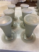 six Tupperware dessert cups with lids