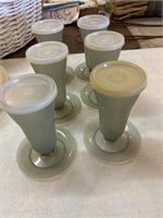 six Tupperware dessert cups with lids