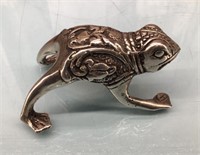 Ornate metal frog