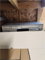 Sanyo DVW-7100 DVD/VCR player. Powers on.