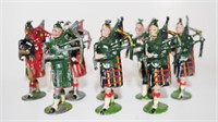 Eight various metal soldiers with bagpipes