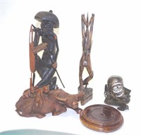 Four various carved wood figures
