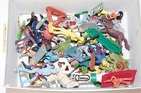 Box of various plastic cowboys and Indians