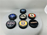 collection of hockey pucks