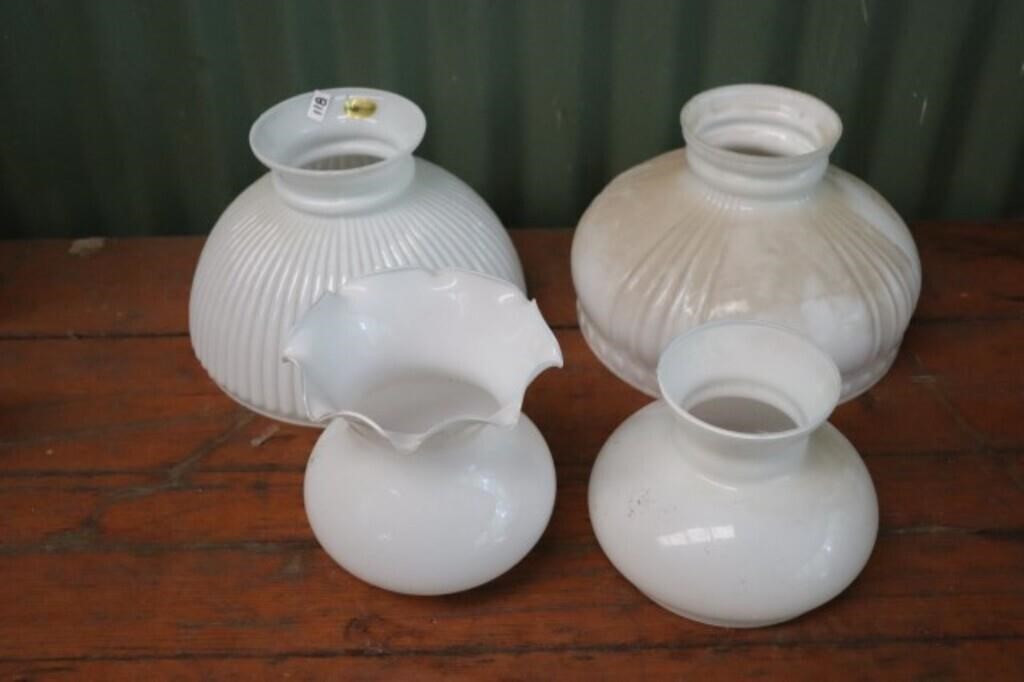 4 Milk Glass Hsades of different sizes