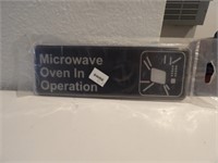 BID X 2:  New "MICROWAVE OVEN IN OPERATION" BLAC