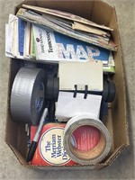 Box of office supplies and maps