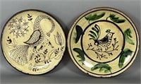 2 large folk art slip decorated redware plates