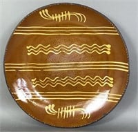 Large redware slip decorated charger by
