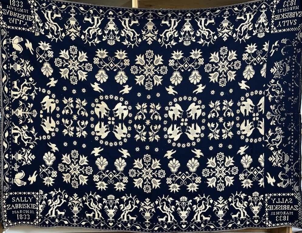 Dark blue and cream double weave coverlet of