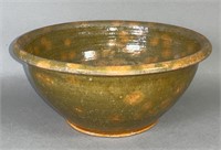 Redware bowl ca. 1890; with a rolled rim, bowed