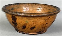 PA redware bowl ca. 1870; with a rolled rim,