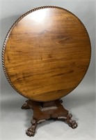 Empire tilt top table ca. 1850; in mahogany with