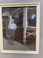 Colorized Richmond storefront photo with owner