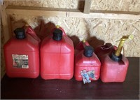 4 Gas Cans with Fuel Unknown