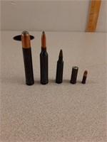 5 dummy rounds of .458 Win, .264 Win, .22-250, .38